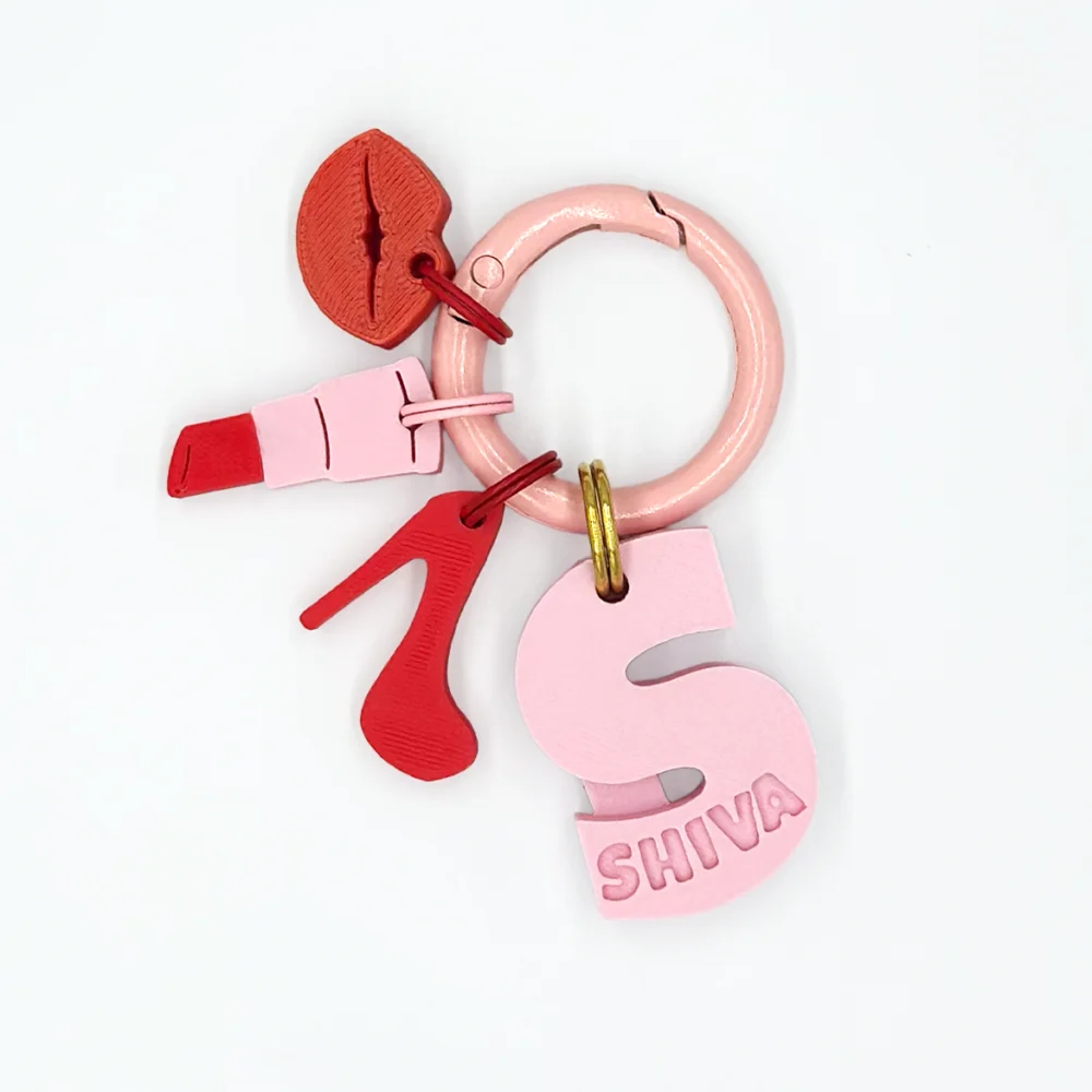 IdentiTag Chapa identificativa personalizada para perros con nombre en bajo relieve, número de teléfono visible y charms intercambiables como emojis, rayos o iconos NFC. Diseño moderno, ideal para perros con estilo WOD3D